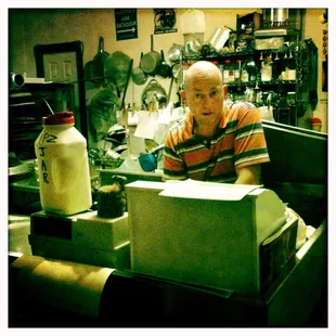 A surprised Blaine realizes his photo is being taken... he makes all the pizzas at his awesome Shoppe.