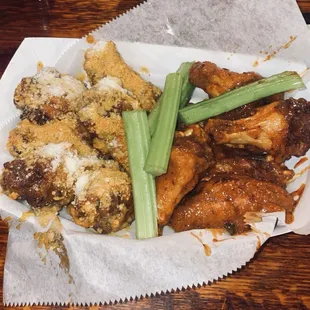 Left: hot garlic parm wings. Right: wet Cajun wings