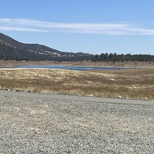 Photo from oak knoll side site #26. Super low water level this year. There are boats out... but we sunk a boat here when it had water. Lol.