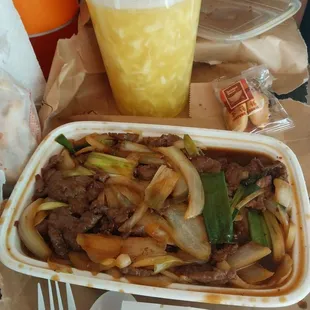 Egg drop soup, mongolian beef, fortune cookie, orange drink.