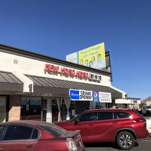 two cars parked in front of a restaurant