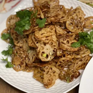 a plate of noodles and meat