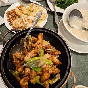 Bass in clay pot, walnut shrimp, veggies, seafood soup with fish