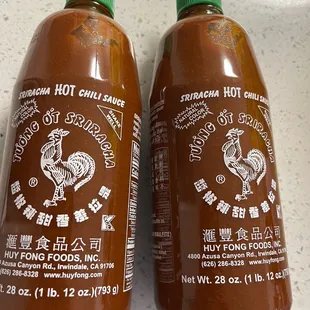 two bottles of hot sauce