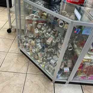 a display case full of soda cans