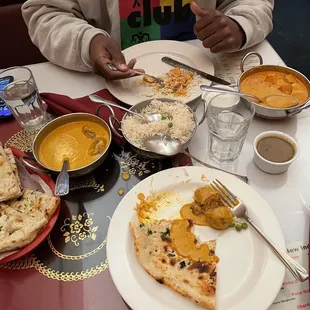 Veggie masala, chicken Chicken Tikka Masala, plain and garlic Naan Bread, lentil soup, and Pilau Rice