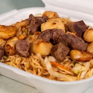 beef and noodles in a styrofoam container