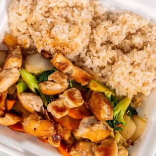 chicken, broccoli, and rice in a styrofoam container