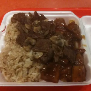 Teriyaki Chicken &amp; Steak.  Notice the heavy sauce, and the splotchy rice coloring.