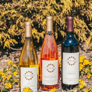 three bottles of wine on the ground