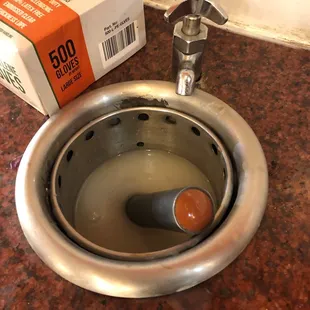 Dirty water for ice cream scoop.