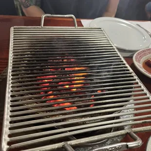 This would be the charcoal grill, way better flavor than gas!