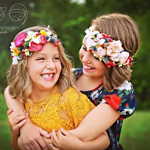 These two cuties don't need anything to shine anymore but flowers add a touch of color to any great portrait!
