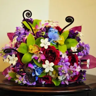 This bridal bouquet is full of some awesome textures: roses, stephanotis, orchids, anthurium, stock &amp; monkey tails knock it out of the park!