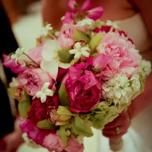 Beautiful bridal bouquet of peonies, orchids, stephanotis and hydrangea.