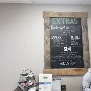 a man sitting in front of a chalkboard