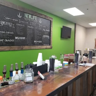 a bar with a menu on the wall