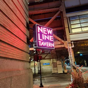 neon sign for new line tavern