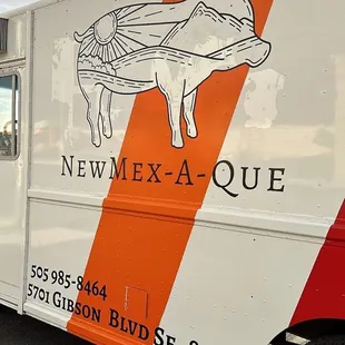 ows a food truck parked in a parking lot
