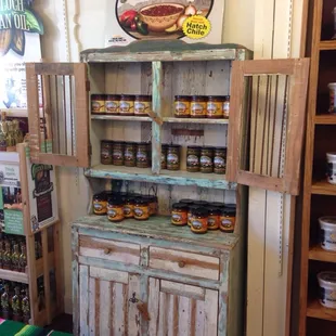 Salsas in a vintage cupboard
