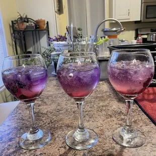 Butterfly Pea Flower Tea + lemon created the purple effect at the top of the glasses!
