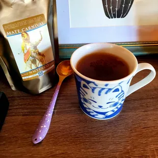 a cup of tea and a spoon