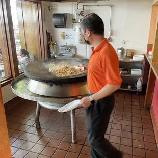 a man standing in a kitchen