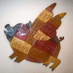 a pig made out of license plates