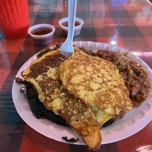 Sliced Texas Style Brisket w/ cornbread pancakes.