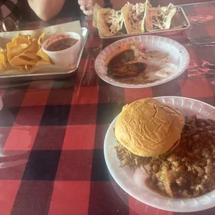 Brisket tacos, wings, pulled pork sammie, baked beans