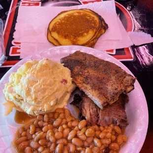a plate of food with beans and a side of pancakes