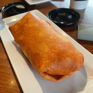 Bike Shop Burrito w/ cheese, bacon, sausage, salsa, and seasoned rice
