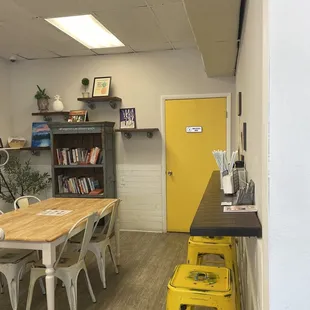 a bright yellow door and table