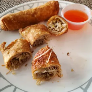 Chicken Egg Rolls from New Moon $1.65 each cut for dipping.  Sauce too watery. Thursday 8/24/2023