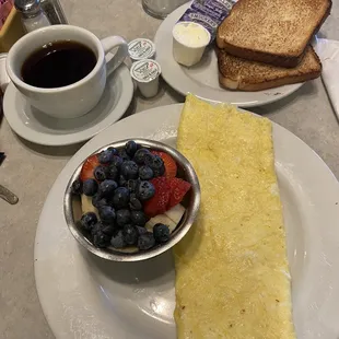 Cheese Omelette with White Toast, cup of fruit, and Hot Coffee