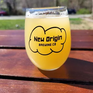 a glass of beer on a table