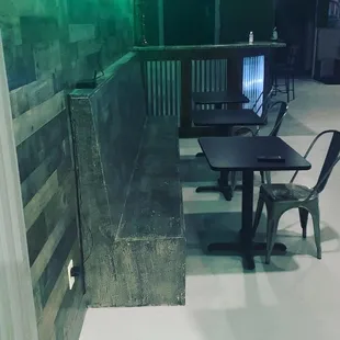 a small table and chair in the corner