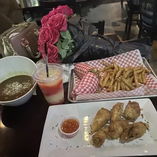 Gumbo, Louisiana Seafood Rolls, daiquiri, and Shrimp Po&apos;Boy! All very good