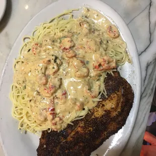 Blackened Redfish Pontchartrain with crawfish Pontchartrain sauce over Angel hair pasta