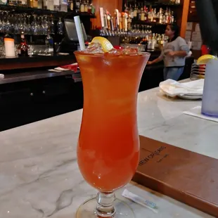 a tall glass of cocktail