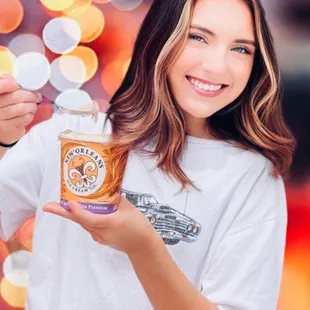 a woman holding a cup of ice cream