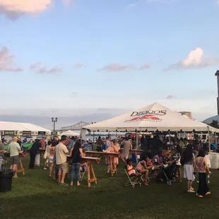 a large crowd of people under tents