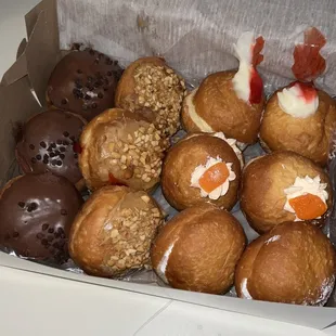 3 Triple Chocolate, 3 Peanut Butter &amp; Jelly, 2 Strawberry Cheesecake, 2 Orange Creamski, and 2 Buttercream Paczkis
