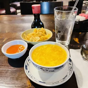 a bowl of soup and two bowls of noodles