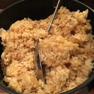 a bowl of rice with a spoon