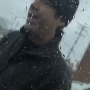 a man standing in the rain