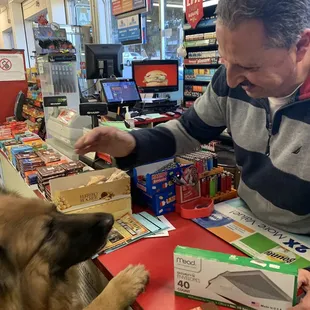 This is the nice store owner who gives me treats! and where my mom buys yummy chocolate and not so yummy envelopes.