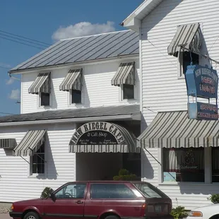 a red car parked in front of it