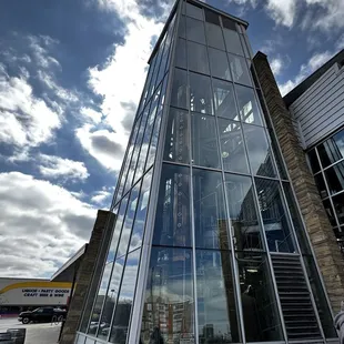 a tall glass building with a lot of windows