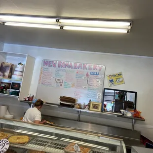 a baker working behind the counter